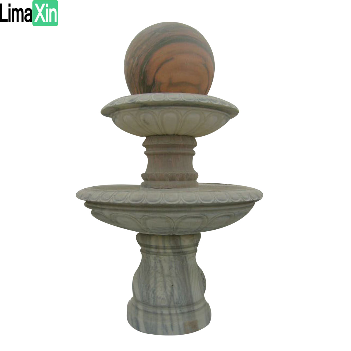 Ball sitting on a black granite fountain — image 2